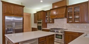 Newly remodeled kitchen featuring an island, marble countertops, and modern appliances.