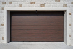 Modern and wide brown garage door. Automatic garage door